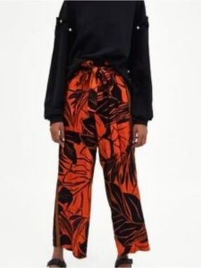 NWT Vibrant Blood Orange and Black Leaf Print Pants